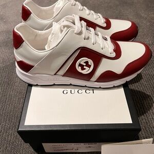 New, never worn Gucci Miro runners. Size 7.5. Red and white.